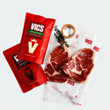 Red Vics packaging with raw steaks on a white background