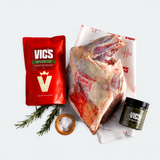 VICS branded product package with raw meat, rosemary, salt, and a container on a white background